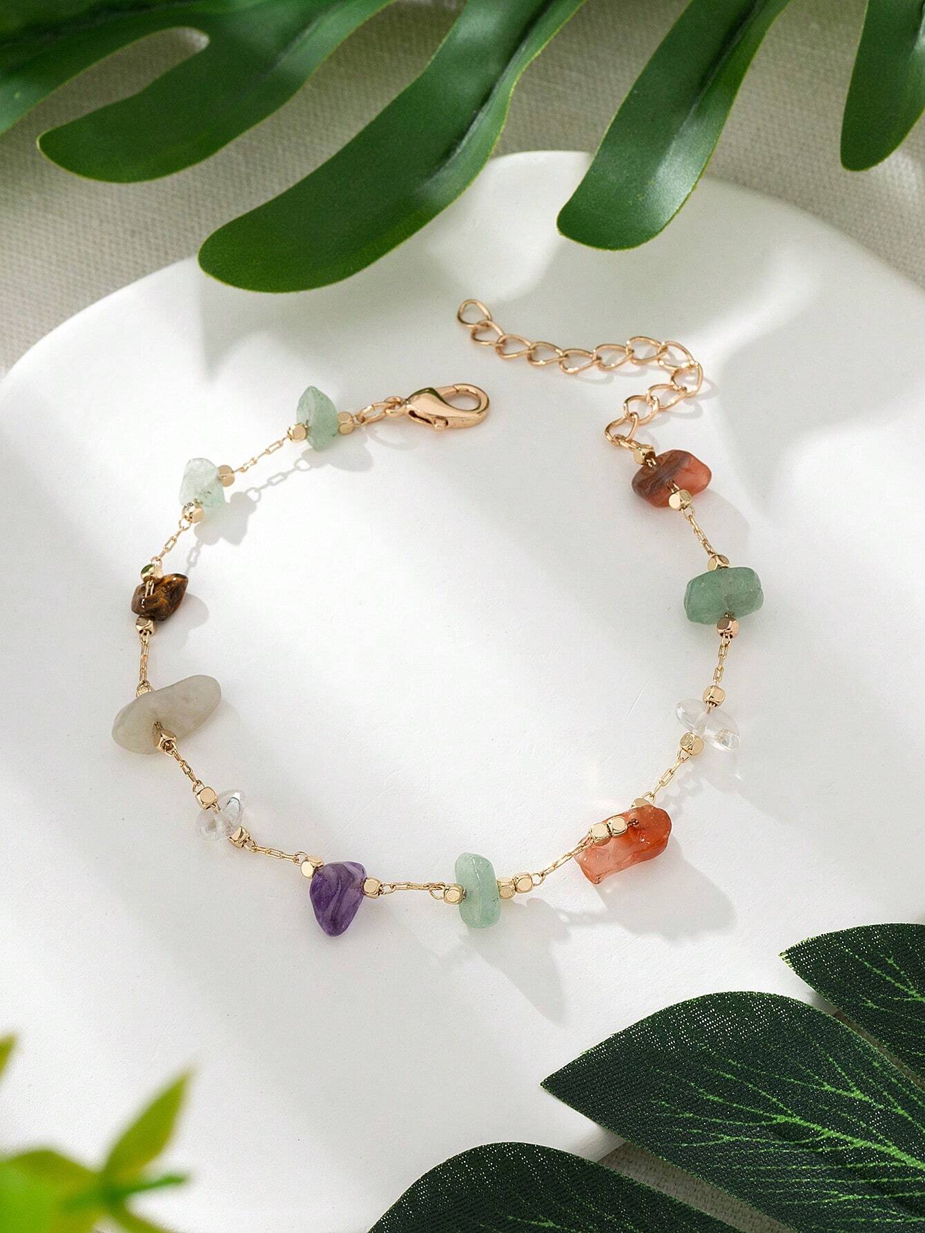 pulsera con minerales variados y cierre en color oro
