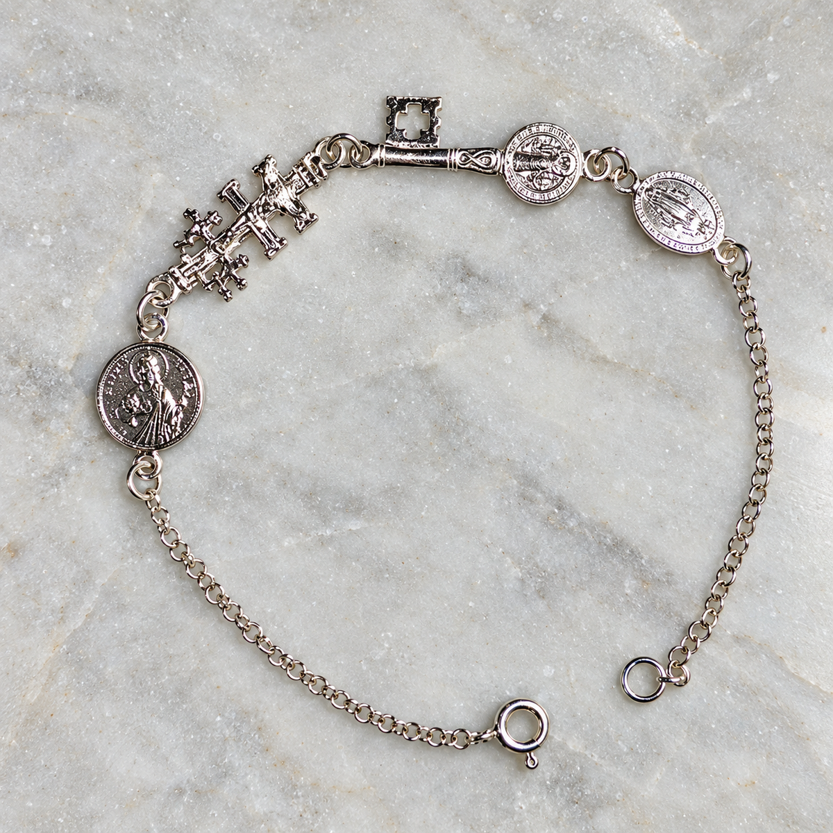 Pulsera Cuadruple Protección en Plata de Ley - La Milagrosa, Cruz de Caravaca, San Judas y Llave de San Benito