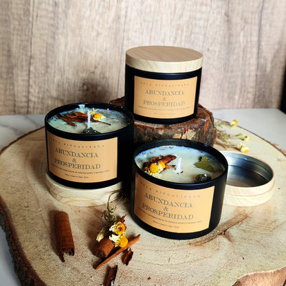 Velas ritualizadas Abundancia y Prosperidad en bote negro con tapa de madera, decoradas con pirita y hierbas mágicas. Artesanal Magic Moon.